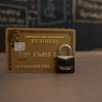 An American Express card with a lock in front of it