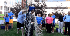 Dannible & McKee, LLP team pouring water on Tom Fiscoe for a community involvement event