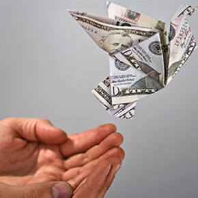 Origami money flying out of hands