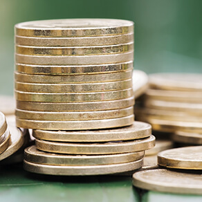 Gold money coins stacked together