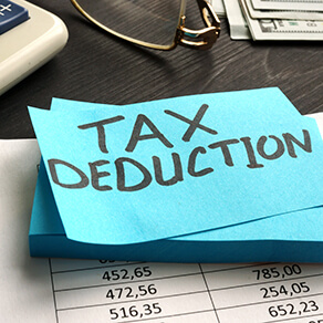 Tax deduction written on a piece of paper.