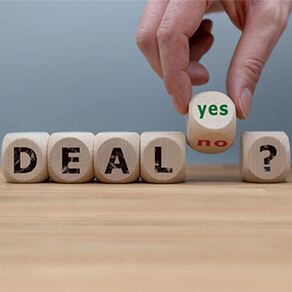 Wooden blocks spelling out deal? with yes/no block