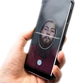 Man holding phone doing face scan