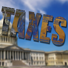 Taxes text over image of the United States capitol building in Washington DC