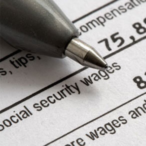 Pen pointing to form with Social Security Wages amount to be entered