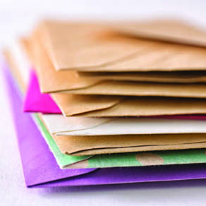 A stack multi-colored envelopes