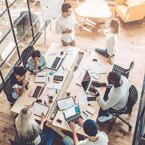 Ariel view of office and people working at a common space