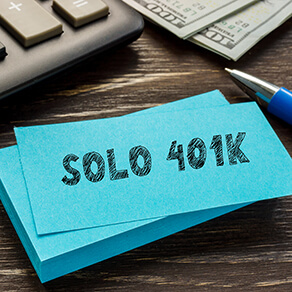 Business concept meaning SOLO 401K with inscription on the page.