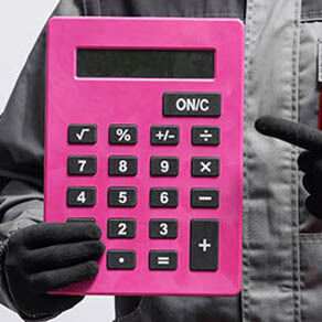 Gloved hand holding extra large calculator