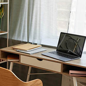 Background image of cozy home office workplace with wooden details and metal shelves with decor items, copy space