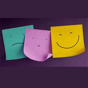 Three Emoticon Faces show on Sticky Notes from Negative to Positive. Bored to Smiling Face. Status of Human Emotion