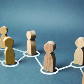 Wooden figures in an off center row