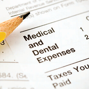 Medical and dental expenses paperwork with a pencil