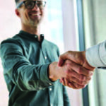 Two business men shaking hands