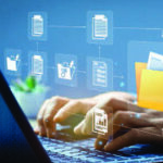 Hands typing on laptop with graphic images overlaid
