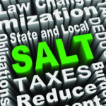 Tax-related three-D words with the word SALT in green in the middle
