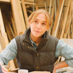 Close Up Of female Carpenter Working In Woodwork Workshop