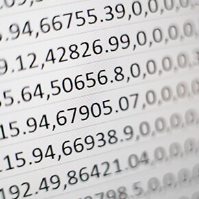 Paper with a bunch of numbers written all over it