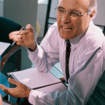 Man arguing with someone with papers in front