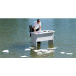 Man standing at a white desk in middle of water with papers scattered on water