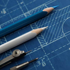 Blueprint with drawing pencils and stencils