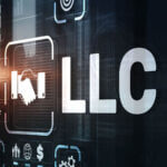 Electronic looking wall with "LLC" and other icons