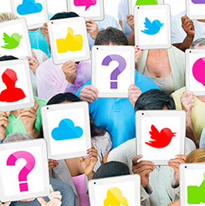 People standing together covering their faces with images of social media icons