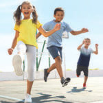 Children outside paying