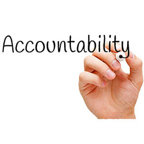 Hand writing Accountability with black marker on transparent wipe board.