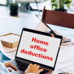 Someone working on a laptop with the words, "Home office deductions" written on the screen