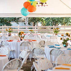 Tables set up for a dinner event.