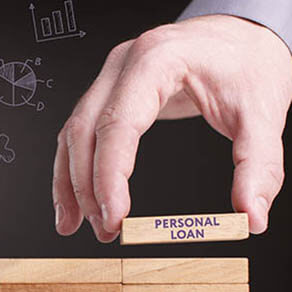 Hand placing block on other blocks with words, 