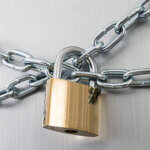 Close-up Of Refrigerator Locked With Chain And Padlock