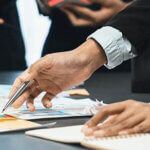 Analyst team use sticky note for financial insight with business Fintech papers for data analysis dashboard. Creative and analytic teamwork idea brainstorming for strategic business marketing