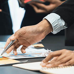 Analyst team use sticky note for financial insight with business Fintech papers for data analysis dashboard. Creative and analytic teamwork idea brainstorming for strategic business marketing