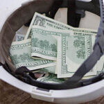 Cash is in the white helmet of the worker