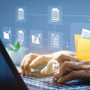 Hands typing on laptop with graphic images overlaid