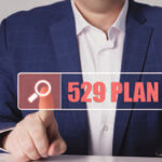 Close up of a man hitting a button that reads, "529 Plan"