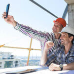 Team Of Builders Happy Smiling Take Selfie Photo During Meeting With Architect And Engineer On Construction Site Discussing Building Plan
