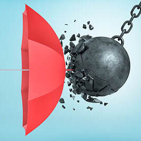 An open red umbrella which protects from a collision with a broken wrecking ball